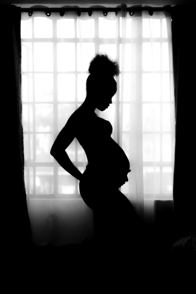 Photo by Mustafa Omar silhouette of pregnant woman